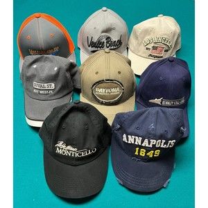 Group of hats and shot glasses from tourist destinations in FL, CA and more